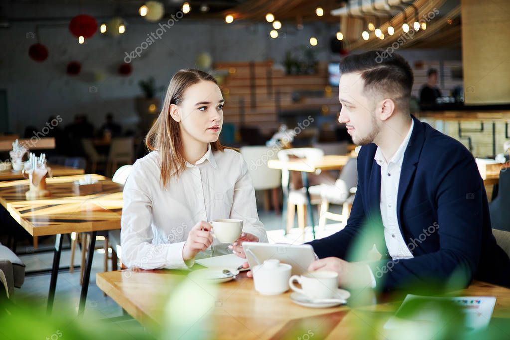 https://st4.depositphotos.com/15528508/21864/i/950/depositphotos_218648968-stock-photo-two-young-business-partners-sitting.jpg